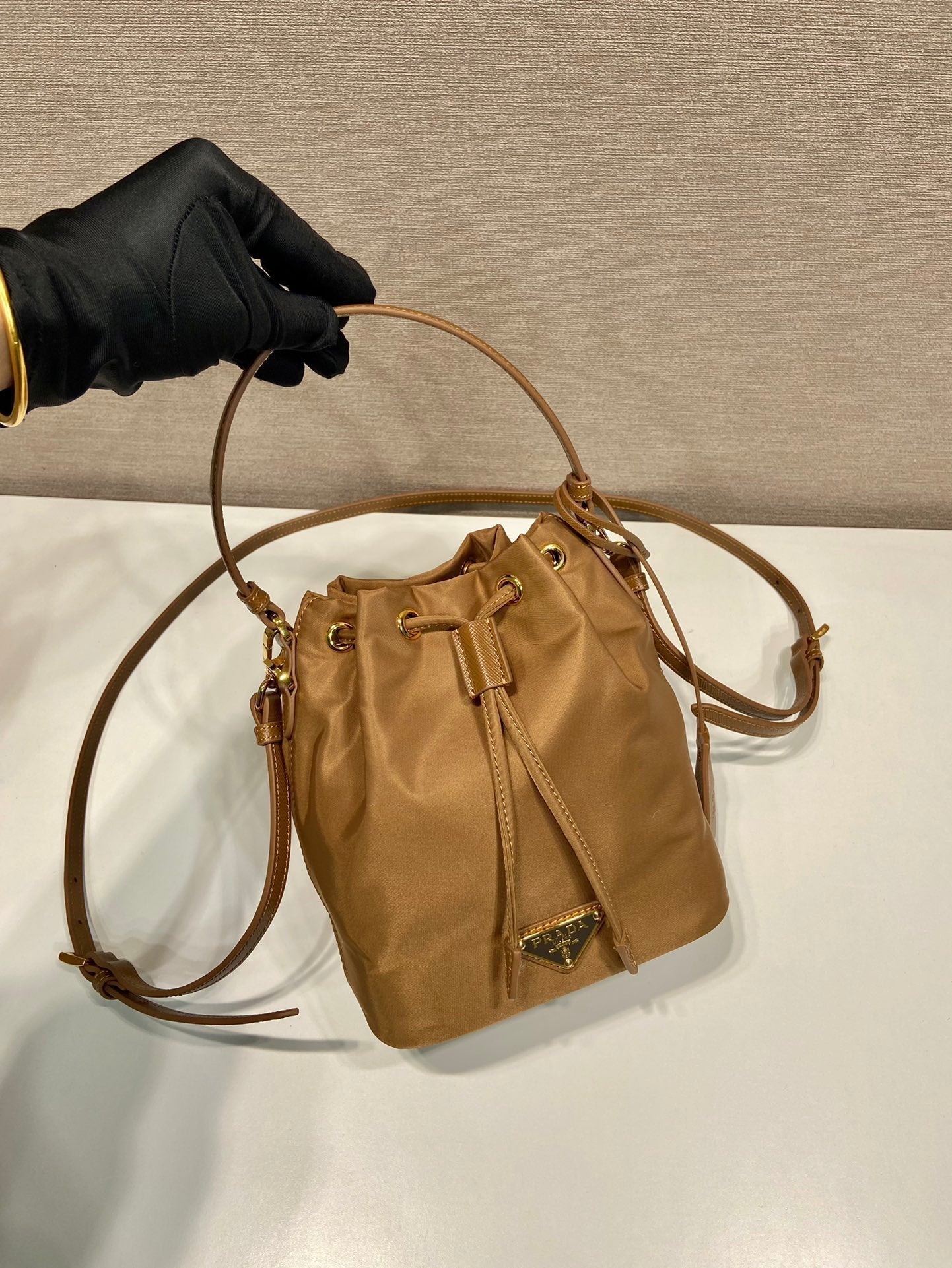 BUCKET BAG 19 IN RUSSET BROWN RE-NYLON AND CALFSKIN HANDLE